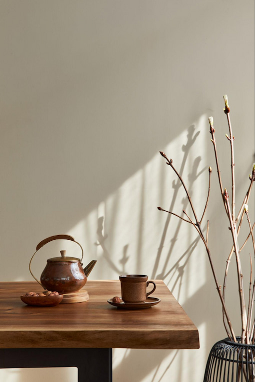 A minimalist concept dining room interior with wooden cup